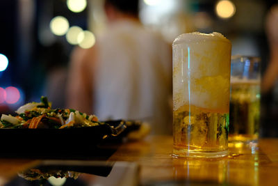 Close-up of beer glass on table