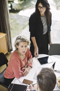 High angle view of business colleagues working in portable office truck