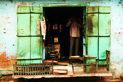 Vendor standing in shop