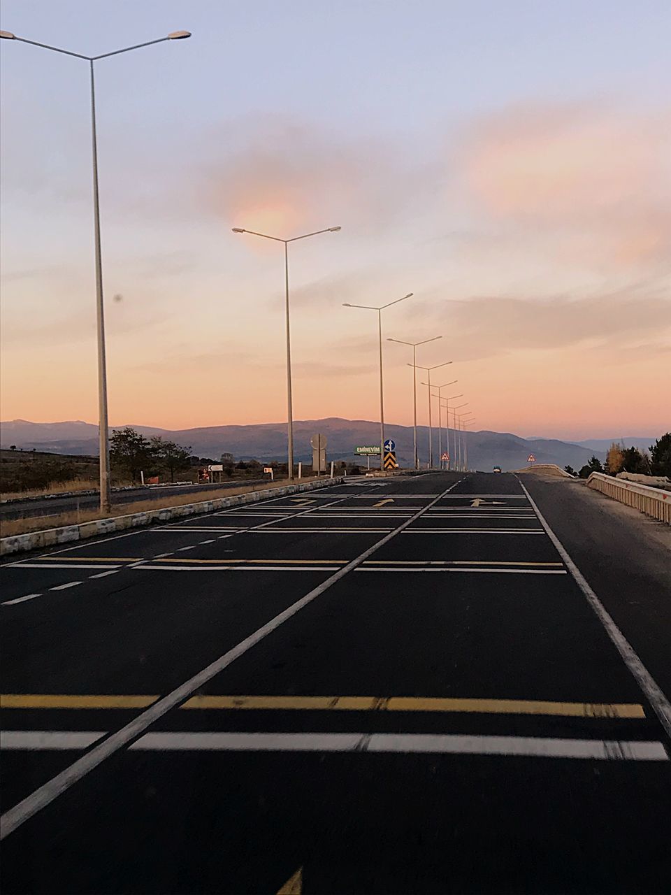 ROAD AGAINST SKY DURING SUNSET
