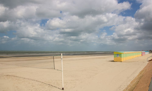 Scenic view of empty beach against sky