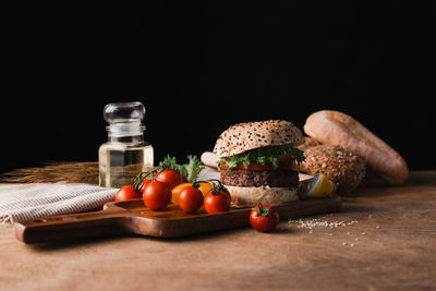 Close-up of breakfast on table against black background