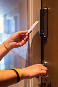 Cropped hand of person using mobile phone