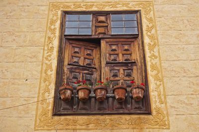 Low angle view of window on old building