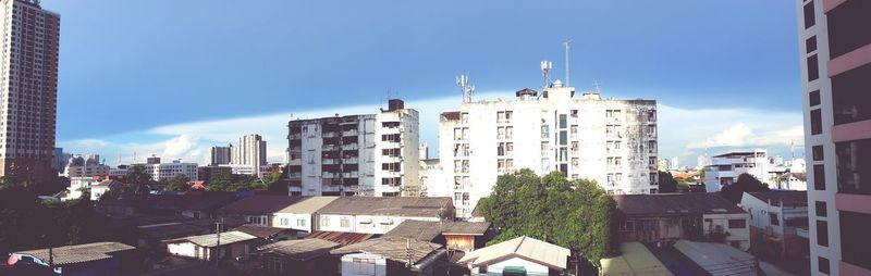 Buildings in city against sky