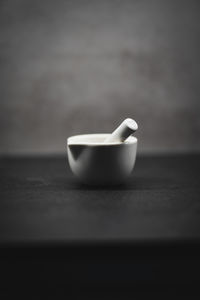 Close-up of coffee cup on table
