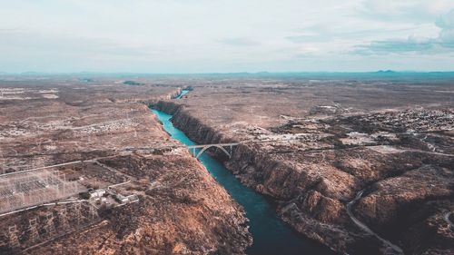 High angle view of river against cloudy sky