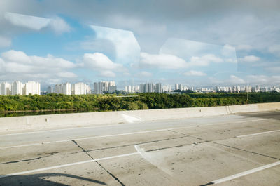 Outskirts of são paulo, brazil, with reflection from car window