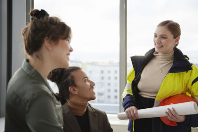 Smiling people having meeting in office