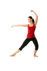 Full length of woman with arms raised against white background