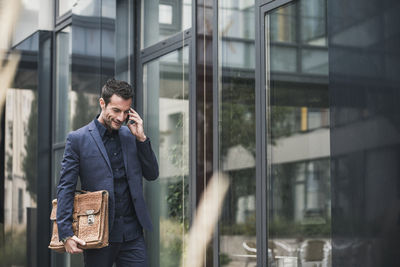 Businessman walking and talking on the phone