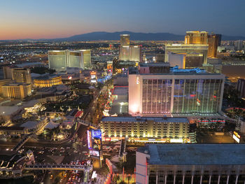 High angle view of illuminated buildings in city at night