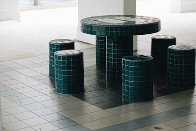 Stack of table and tiled floor