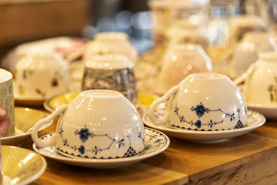 Close-up of coffee cups on table