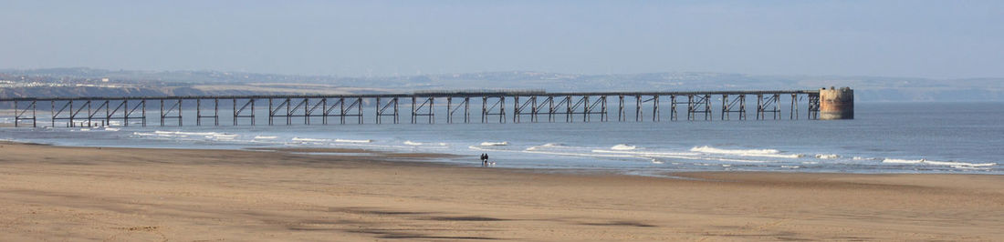 Panoramic view of pier over sea against sky