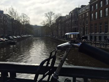Boats in river with buildings in background