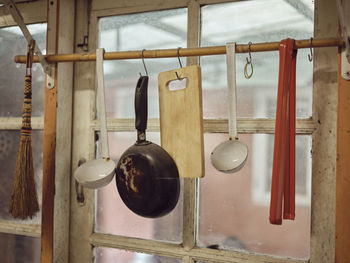 Old kitchen ware hanging on the bar. d