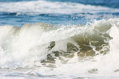 Waves splashing on shore