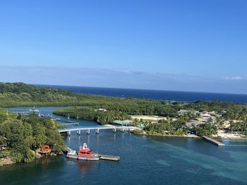 High angle view of sea against clear blue sky