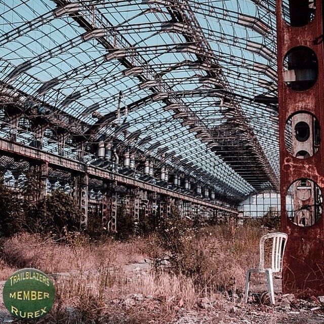 architecture, built structure, indoors, building exterior, low angle view, abandoned, ceiling, tree, day, graffiti, no people, text, obsolete, metal, glass - material, building, plant, interior, damaged