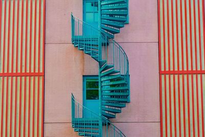 Blue spiral staircase by building