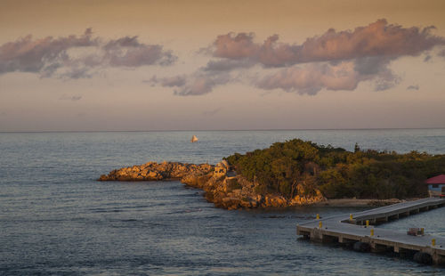 View of calm sea against cloudy sky