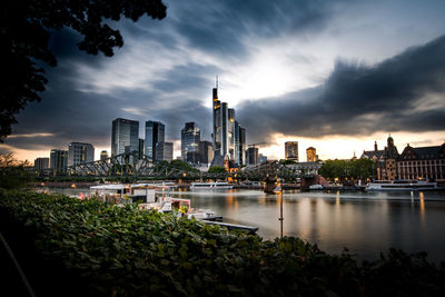 River with buildings in background in frankfurt, germany 