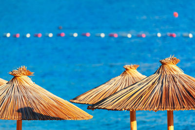 Beach exotic parasol with blue sea at background . beach area for swimming