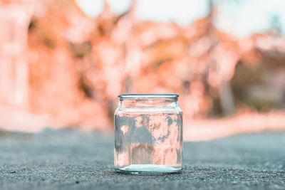 Close-up of glass jar on table