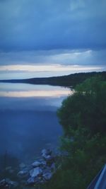 Scenic view of landscape against cloudy sky