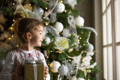 Boy looking at christmas tree