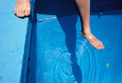 Low section of man in swimming pool