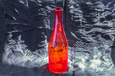 Close-up of red wine in glass bottle