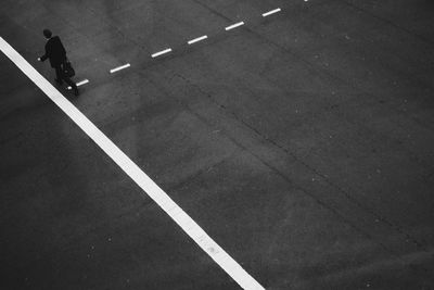 Woman standing on road