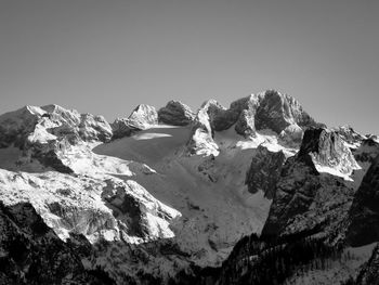 Scenic view of snowcapped mountains against clear sky