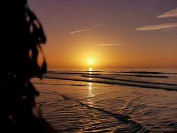 Peaceful sunrise on a beautiful bognor regis beach england, with pastel colours 