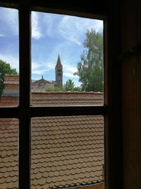 Exterior of building against sky seen through window