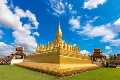 Temple building against cloudy sky