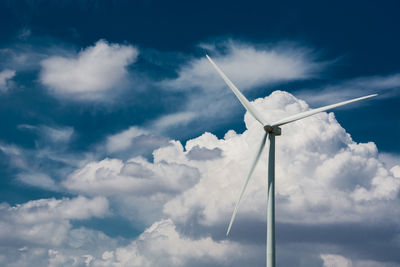 Low angle view of wind turbine against sky