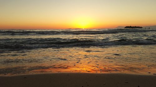 Scenic view of sea against sky during sunset