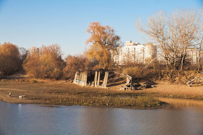 Scenic view of lake against clear sky during autumn