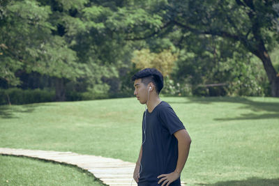 Young man standing on field