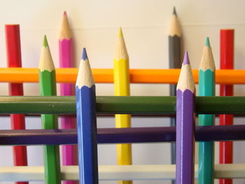 Close-up of colorful pencils on table