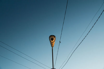 Low angle view of cables against clear sky