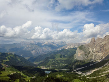 Scenic view of valley and mountains against sky