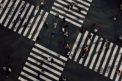 High angle view of people crossing road