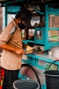 Man working at market stall