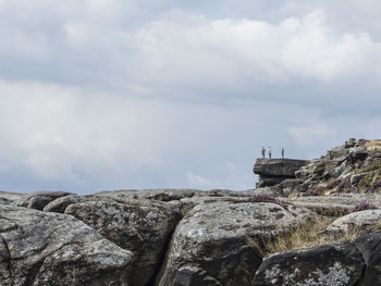 View of cliff against cloudy sky