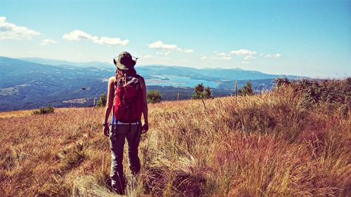 Rear view of woman standing in park