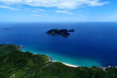 High angle view of sea against blue sky